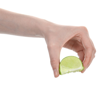 Woman squeezing lime on white background, closeupの写真素材