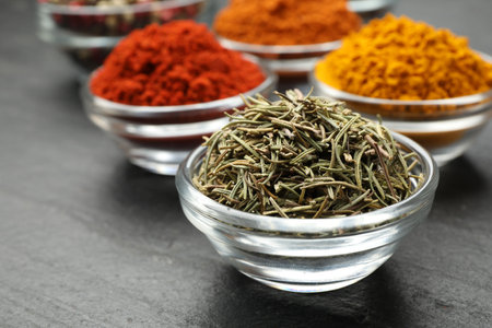 Different aromatic spices on gray table, closeupの写真素材