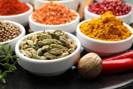 Different aromatic spices in bowls on table, closeupの写真素材