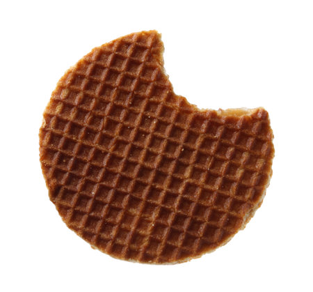 Bitten round Dutch waffle isolated on whiteの写真素材