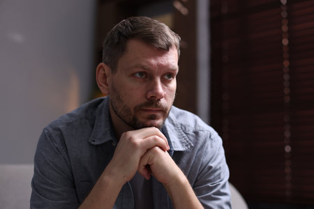 Depressed man at home. Mental health problem