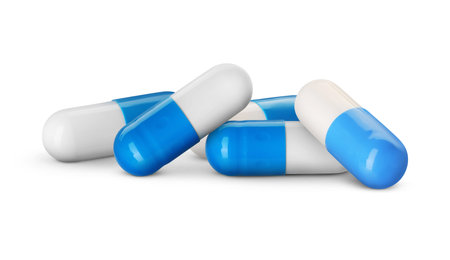 White and blue capsules on white background