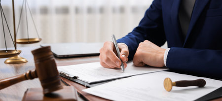 Judge signing document at table, closeup. Banner designの写真素材