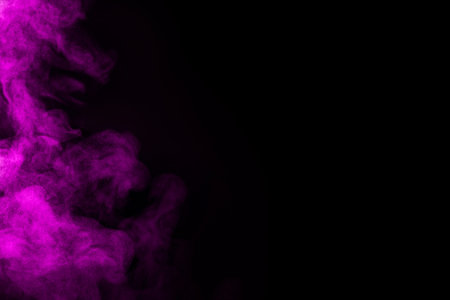 Bright magenta smoke in air on black background, space for text