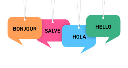 Paper speech bubbles with greetings in different languages hanging on white background. Banner designの写真素材