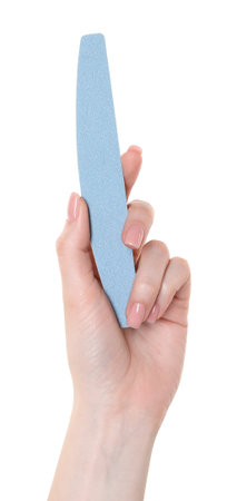 Woman with nail file on white background, closeup. Manicure toolの写真素材