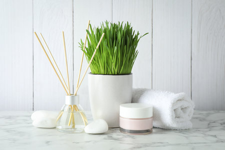 Spa composition with wheatgrass on white tableの写真素材