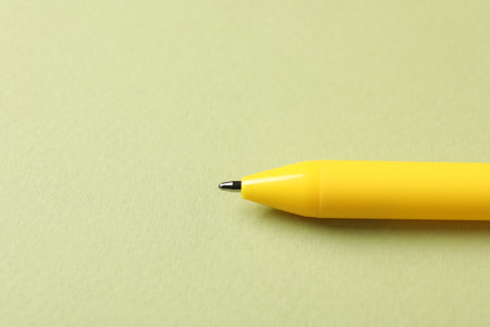 One stylish pen on green background, closeup. Space for textの写真素材