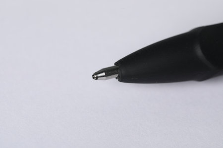 One stylish pen on light background, macro view. Space for textの写真素材