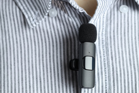 Man with lavalier microphone attached to his shirt, closeupの写真素材