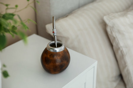 Traditional yerba mate tea on bedside table indoors
