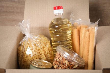 Different food products in box on table, closeupの写真素材