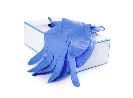 Blue medical gloves and box isolated on whiteの写真素材