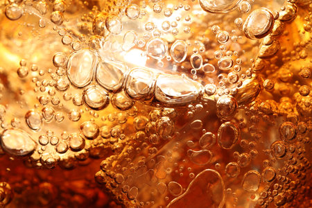 Refreshing cola with ice as background, macro viewの写真素材