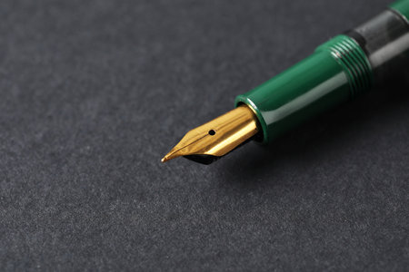 One fountain pen on dark background, macro view. Space for textの写真素材