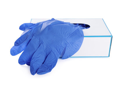 Blue medical gloves and box isolated on whiteの写真素材