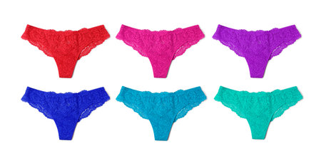 Beautiful women's panties in different colors on white background, set