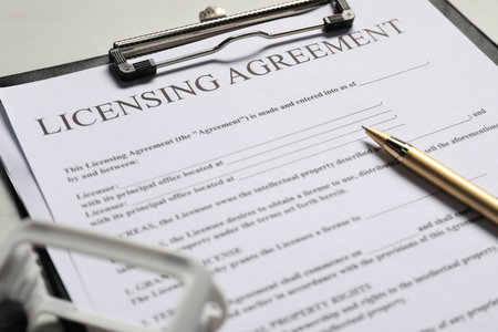 Licensing agreement document, pen and stamp on table, closeupの写真素材
