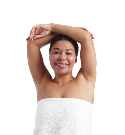 Woman showing hairless armpits after epilation procedure on white backgroundの写真素材