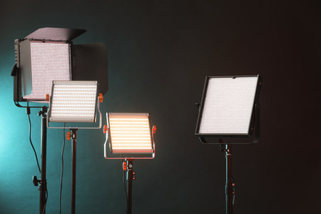 Professional lighting equipment on dark background with color lightsの写真素材