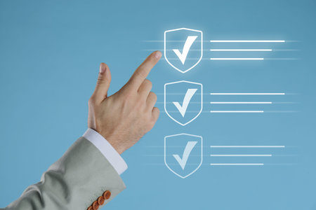Approved. Man touching check mark on virtual screen against pastel blue background, closeup