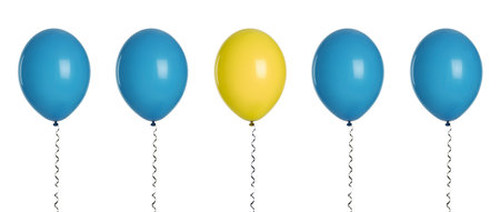 Individuality, uniqueness, different. Yellow balloon among blue ones on white backgroundの写真素材