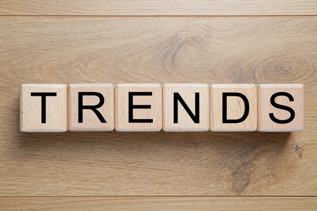 Word Trends made of cubes with letters on wooden background, top viewの写真素材