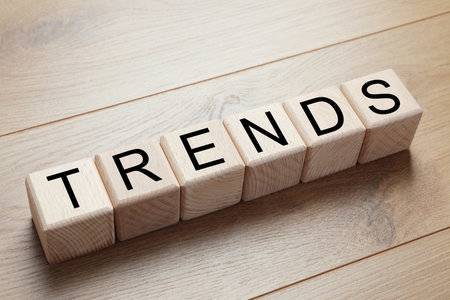 Word Trends made of wooden cubes with letters on tableの写真素材