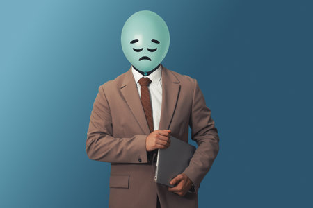Balloon with sad face instead of man's head on blue backgroundの写真素材