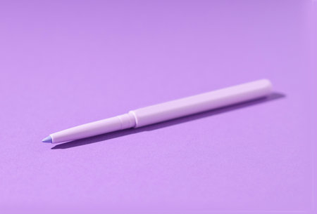 One twist up eye pencil on purple background, closeupの写真素材