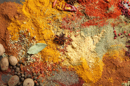 Different aromatic spices as background, top view