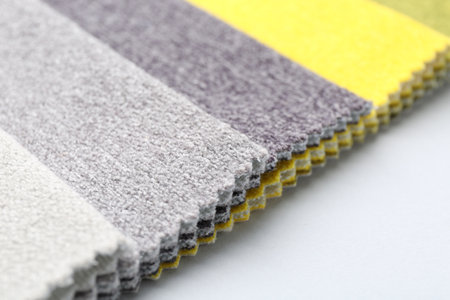 Samples of different fabrics on white background, closeup. Space for textの写真素材