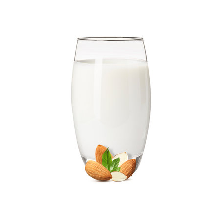 Nut milk in glass and almonds isolated on whiteの写真素材