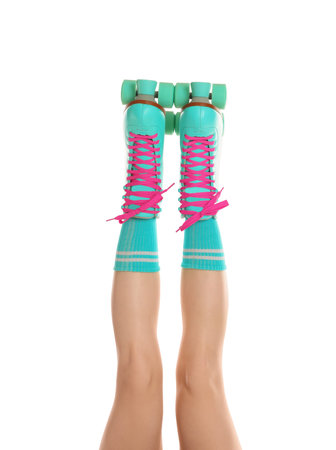 Woman in roller skates on white background, closeup