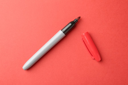 One color marker on red background, top viewの写真素材