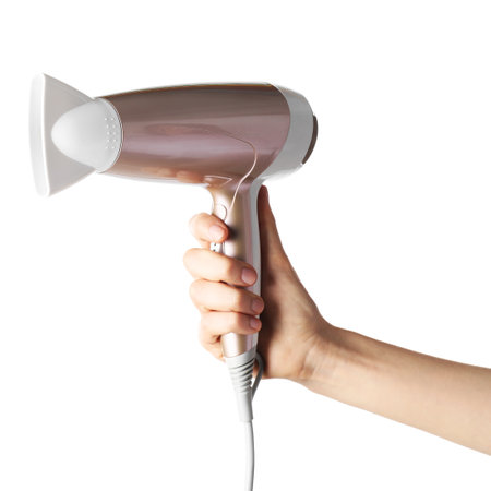 Woman with hair dryer on white background, closeupの写真素材