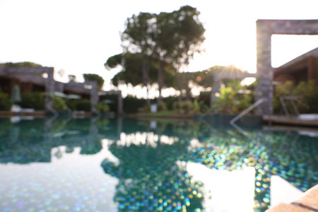 Outdoor swimming pool at resort, blurred viewの写真素材