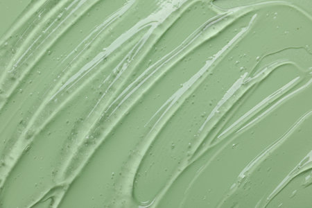 Collagen gel on green background, above viewの写真素材