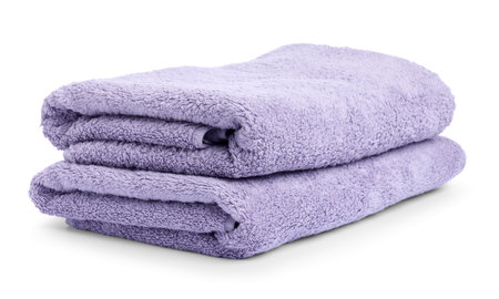 Stack of clean towels isolated on whiteの写真素材
