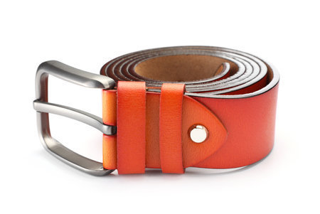 One orange leather belt isolated on whiteの写真素材