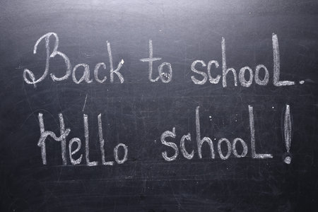 Phrases Back To School and Hello School with exclamation mark on blackboardの写真素材