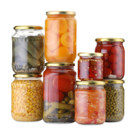 Many jars with different pickled products isolated on whiteの写真素材