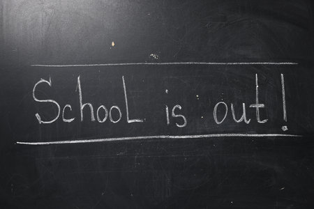 Phrase School's Out with exclamation mark on blackboardの写真素材