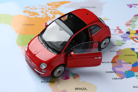 Road trip concept. Car model on world map, closeupの写真素材