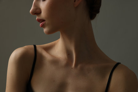 Woman with perfect skin on grey background, closeupの写真素材