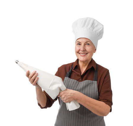 Professional confectioner with frosting bag of cream on white backgroundの写真素材
