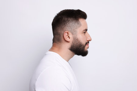 Man before scoliosis treatment on light backgroundの写真素材