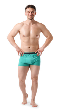 Young man in stylish turquoise underwear on white backgroundの写真素材