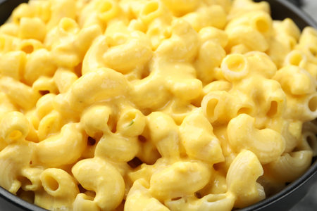 Delicious pasta with cheese sauce in bowl, closeupの写真素材