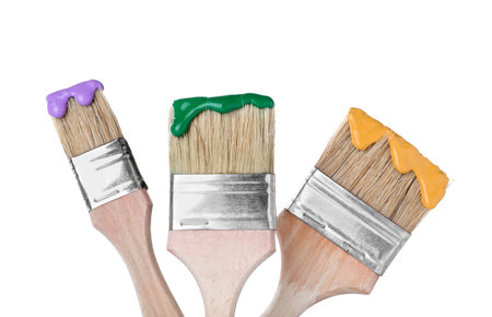 Brushes with color paints isolated on white